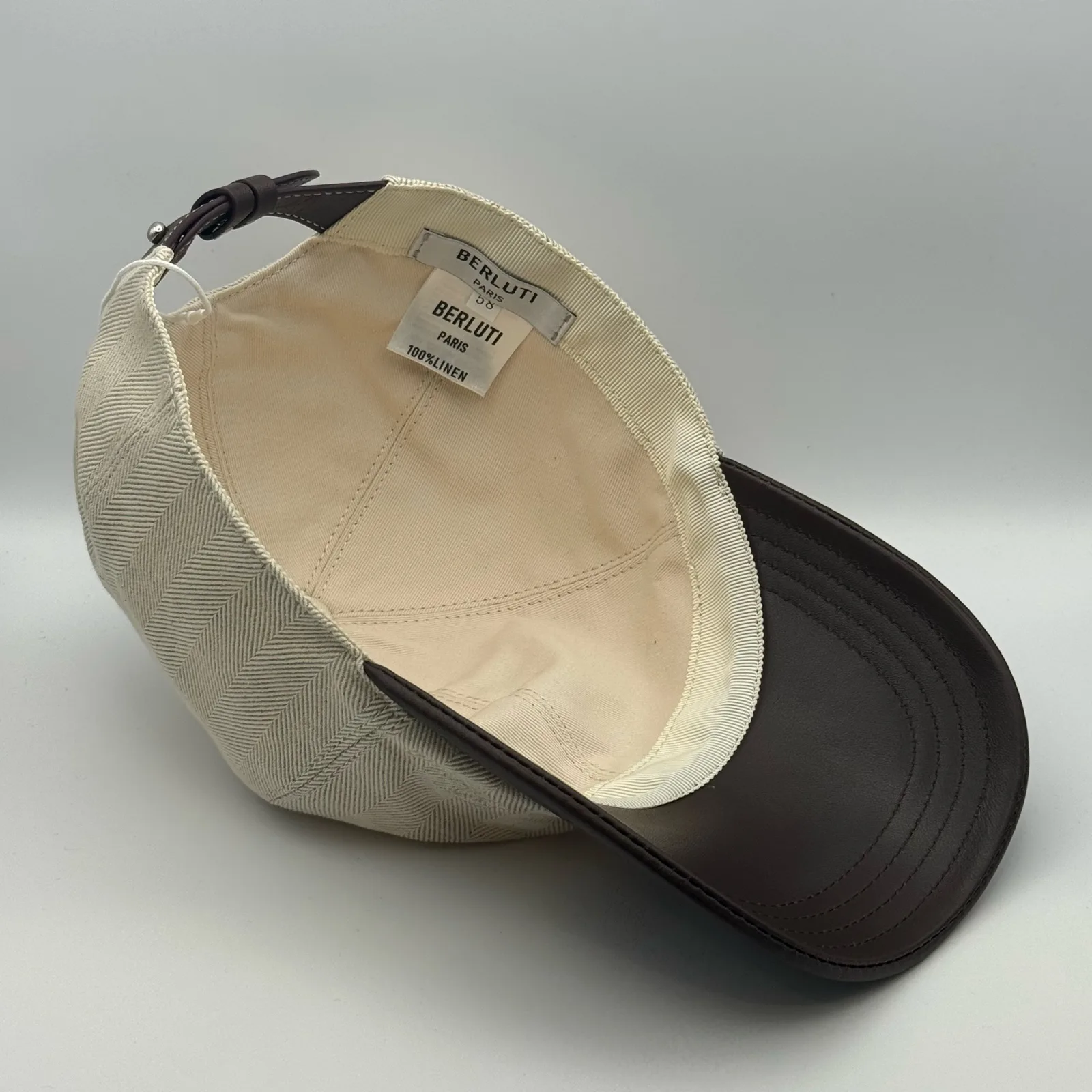 Close-up of the interior brand label and size tag inside the crown.