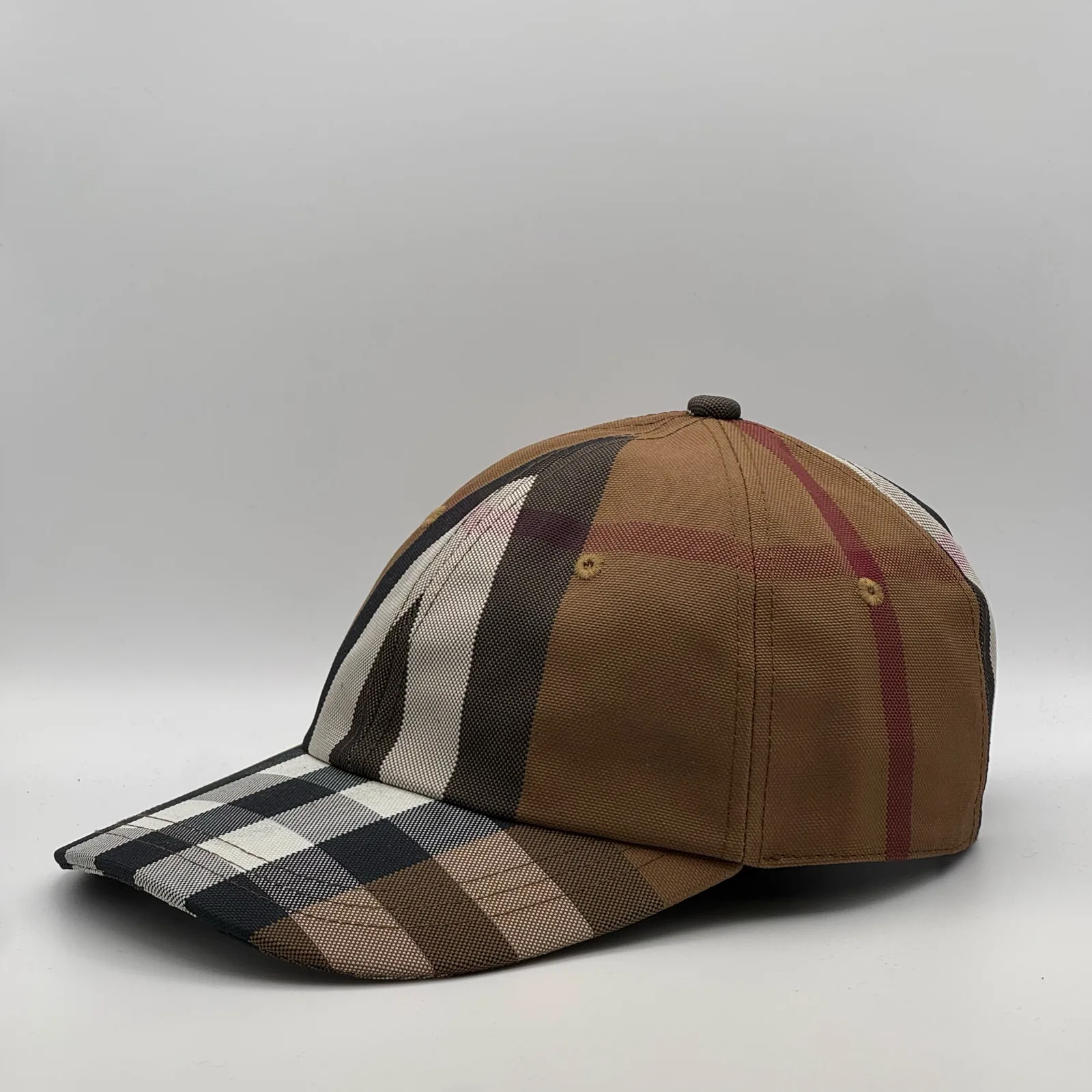 Brown check Burberry cap, three-quarter front-right view.