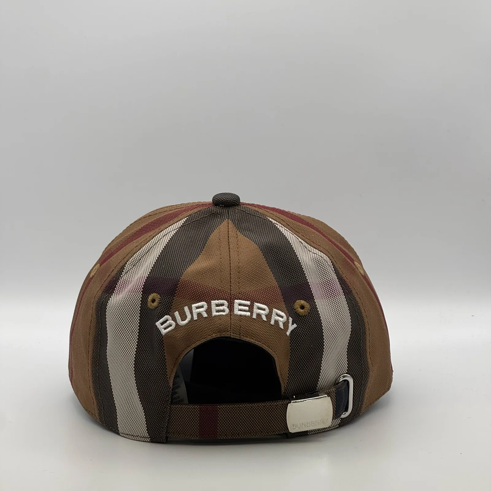 Brown check Burberry cap, back view showing the embroidered Burberry wordmark.