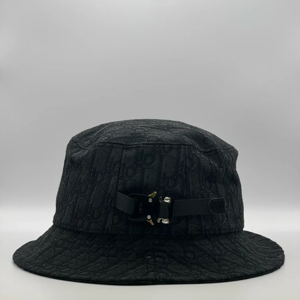 Black Dior Oblique bucket hat, side view showing the buckle strap.