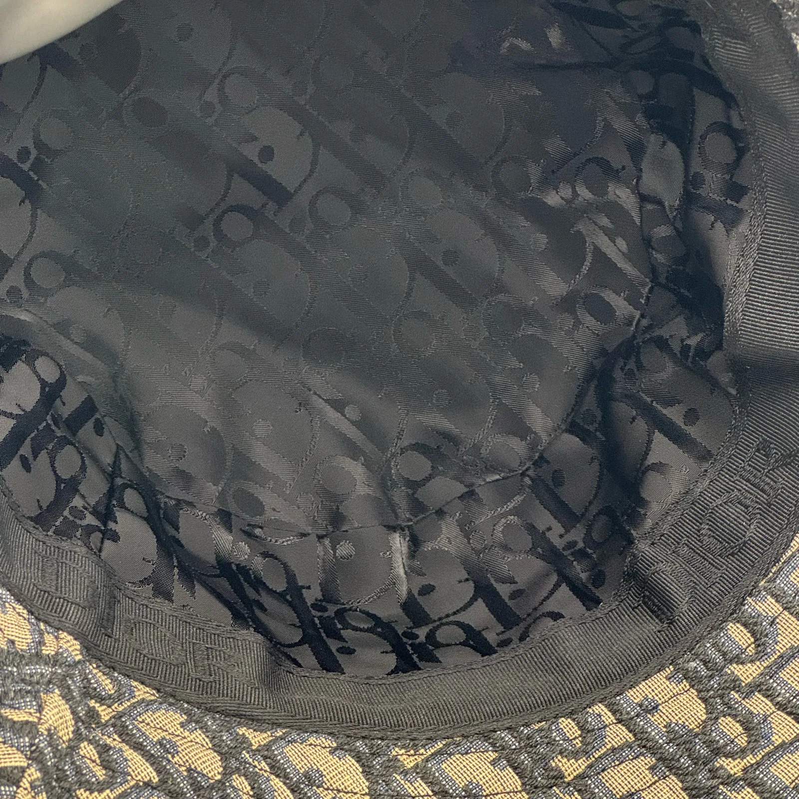 Inside view of the Dior Oblique bucket hat showing the lining.