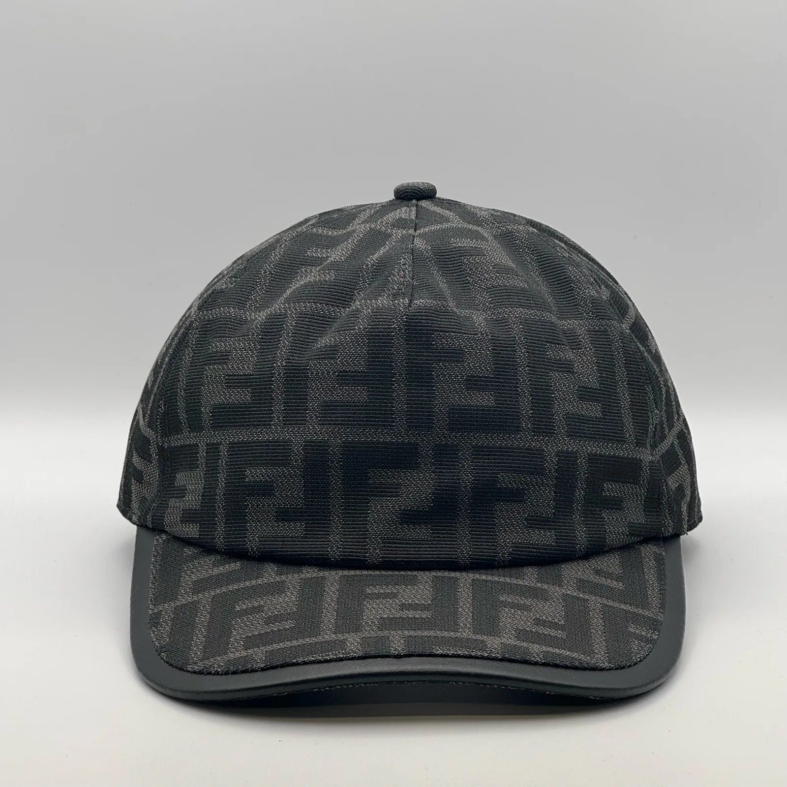 Black-on-black Fendi FF cap, three-quarter front view.