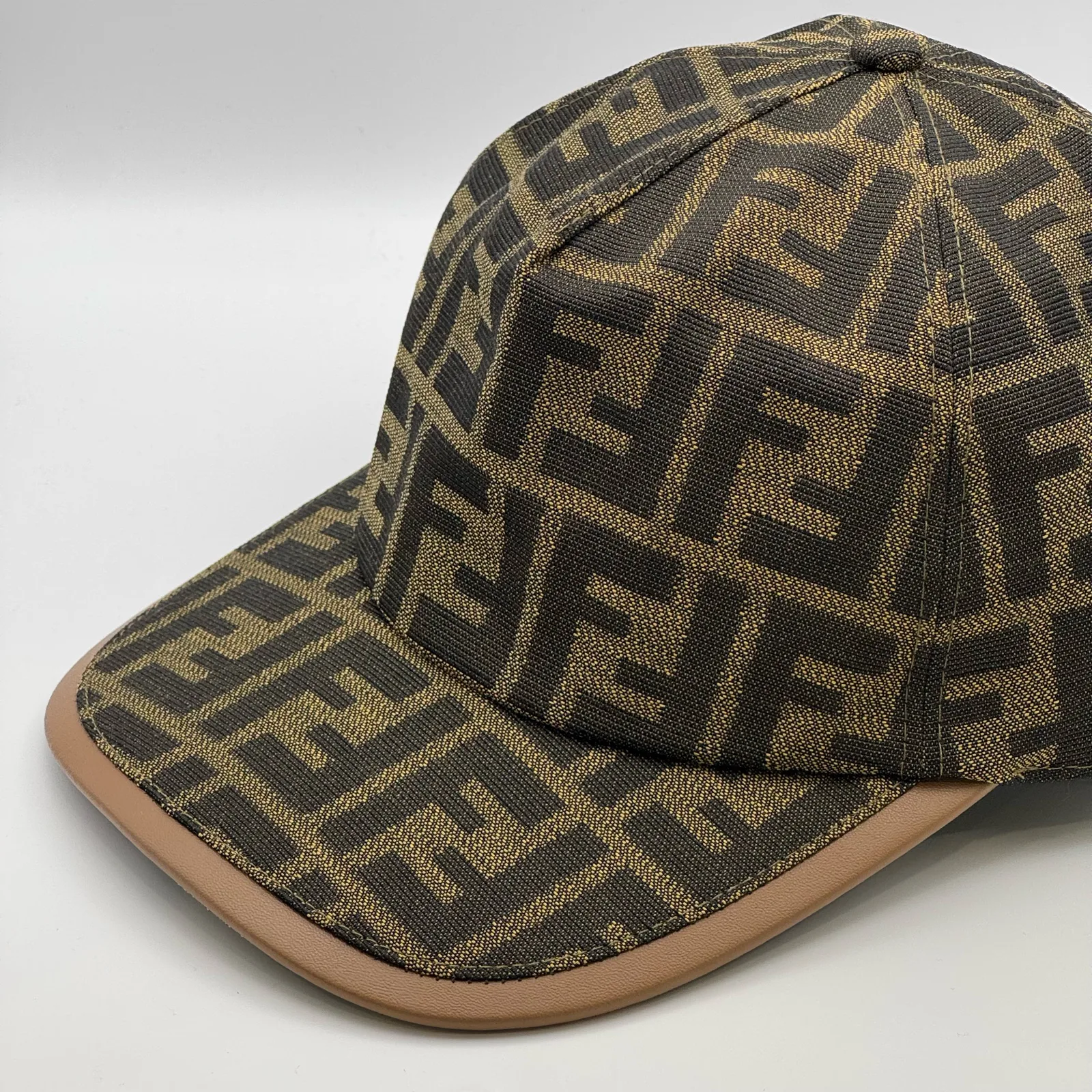 Brown Fendi FF cap, elevated three-quarter view of the crown.