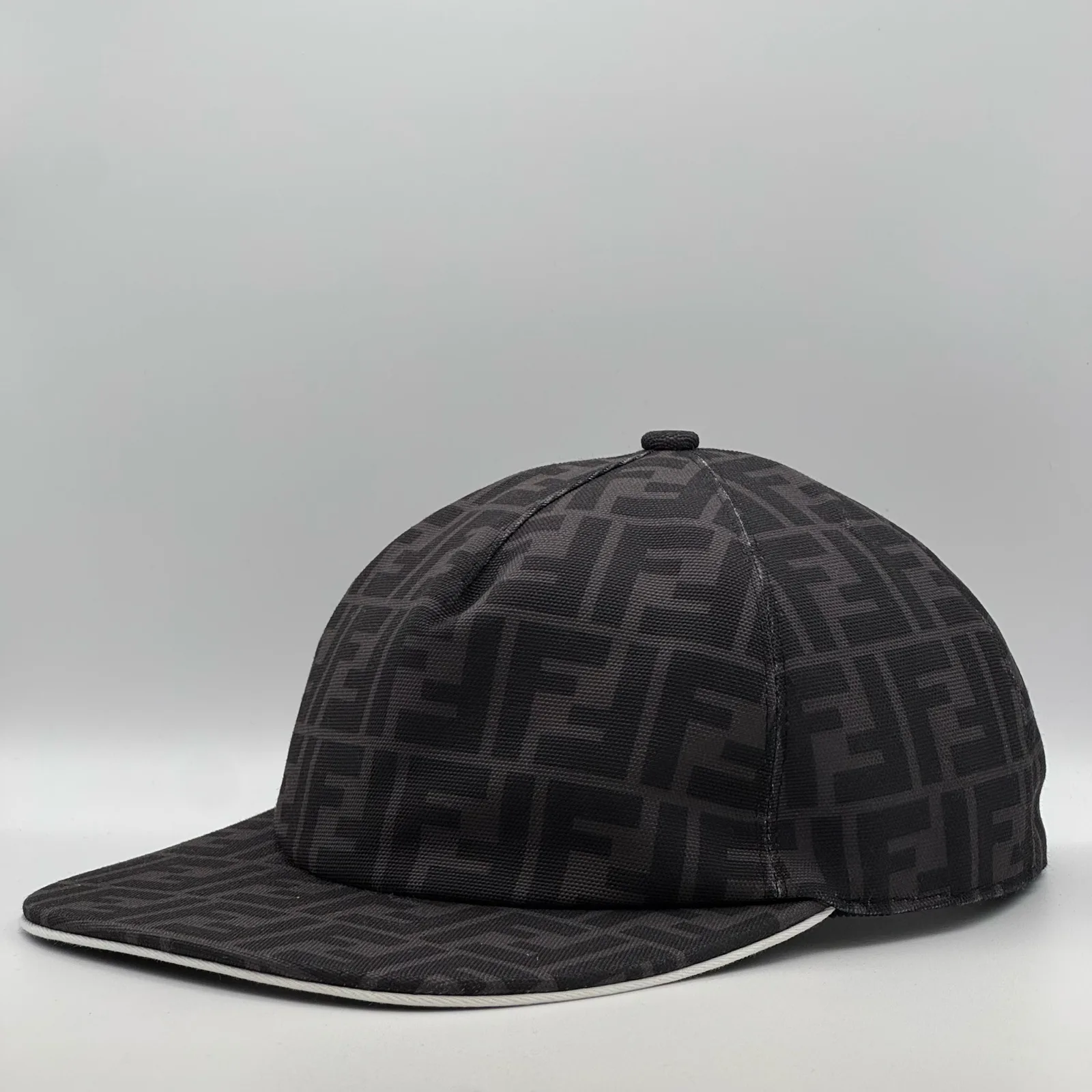 Dark grey Fendi FF cap, side profile.
