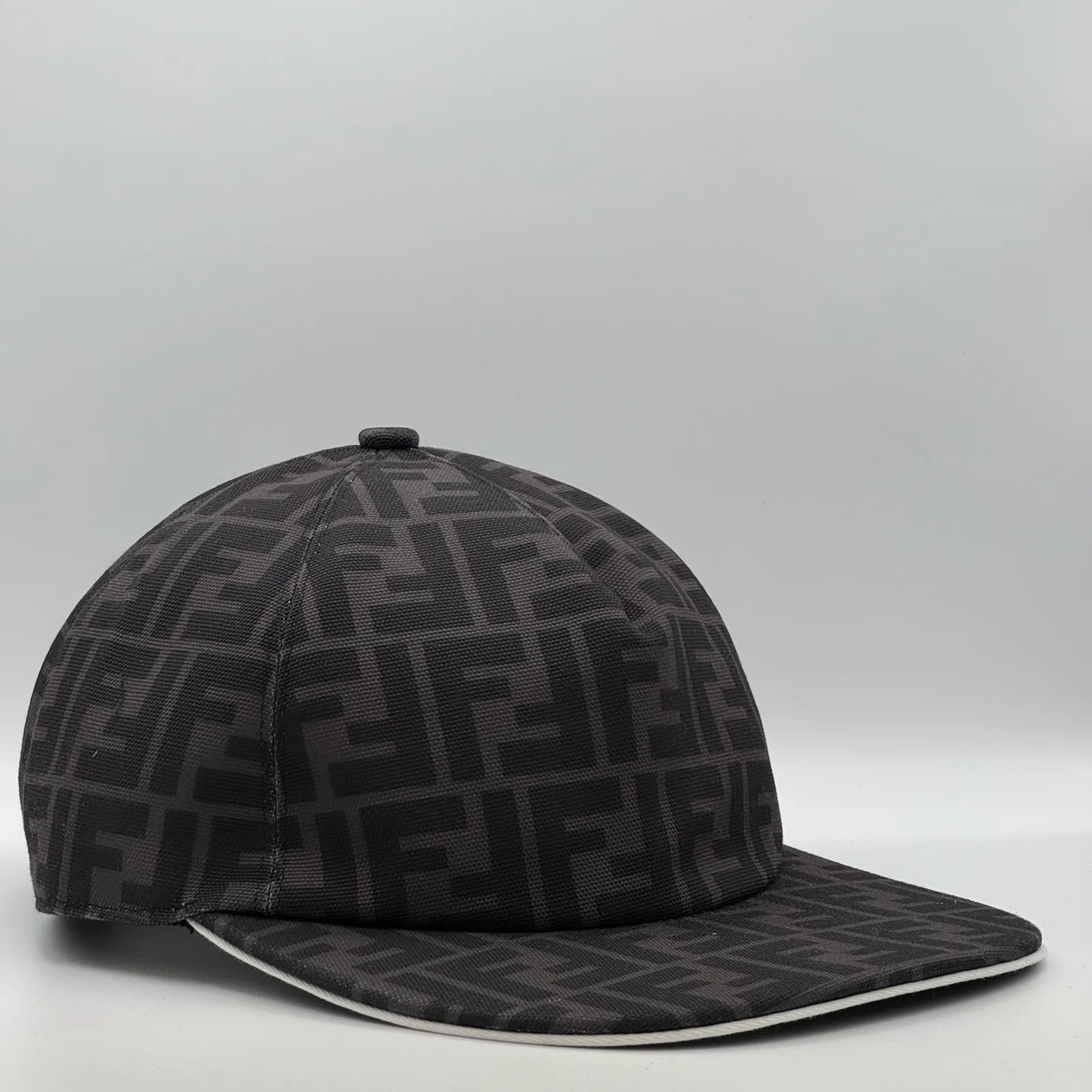 Dark grey Fendi FF cap, front view with white edge piping.