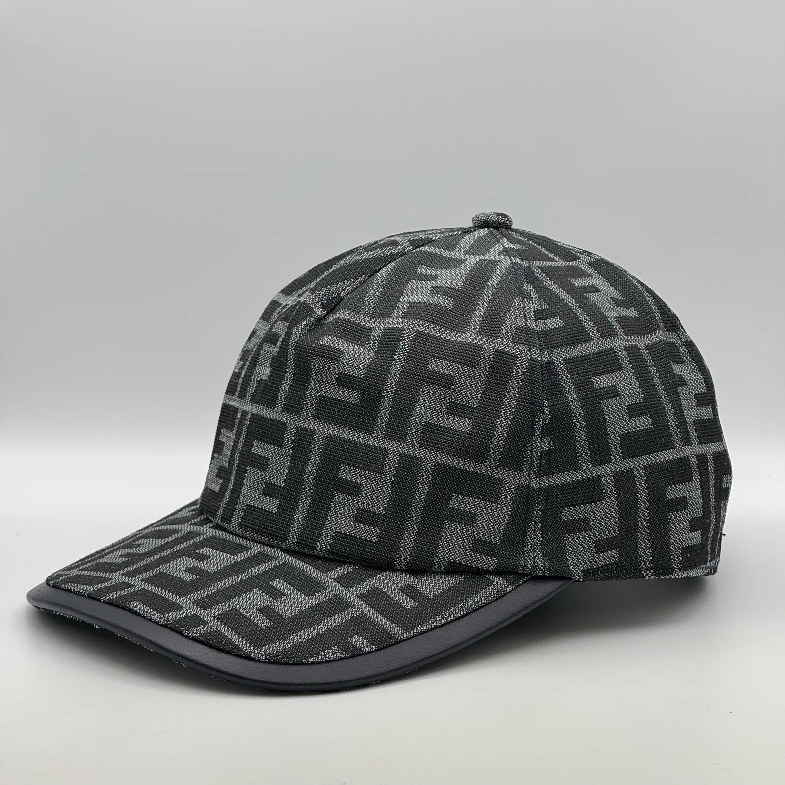 Charcoal grey Fendi FF cap, three-quarter front-right view.