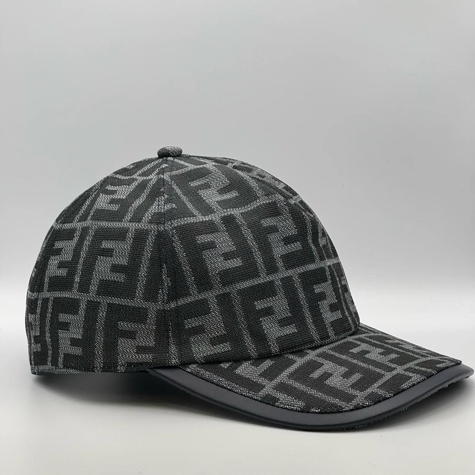 Charcoal grey Fendi FF cap, side profile.