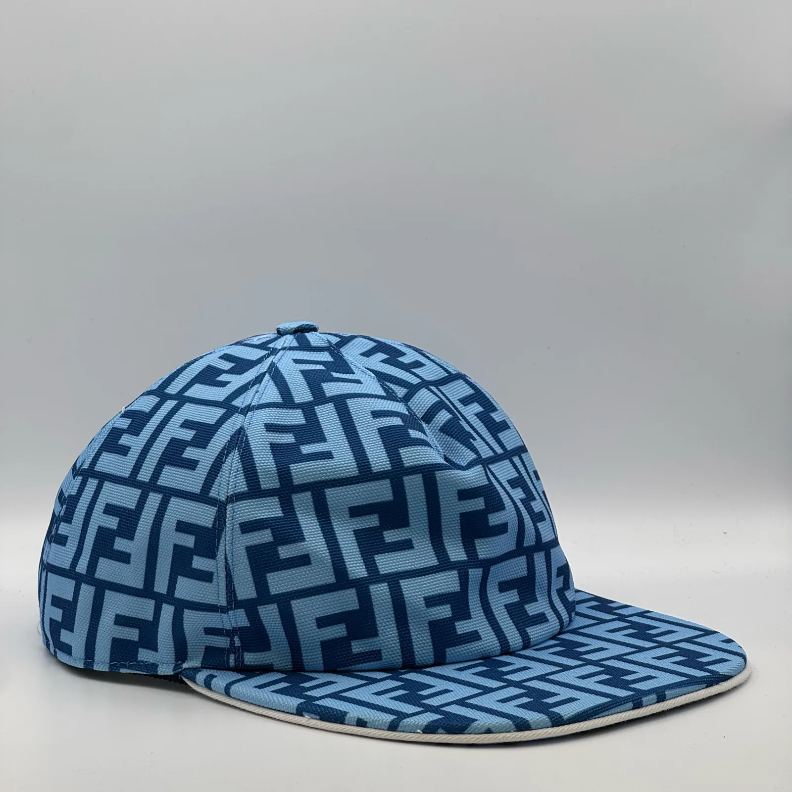 Light blue Fendi FF cap, side profile.