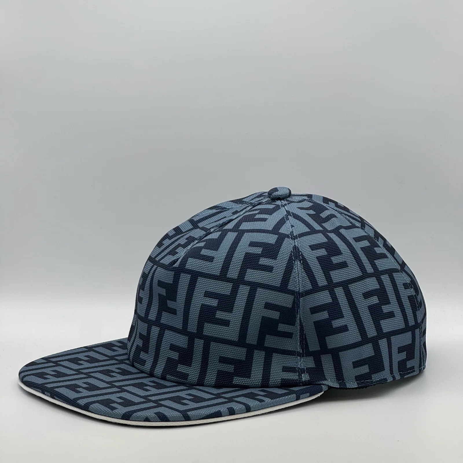 Navy blue Fendi FF cap, three-quarter front-right view.