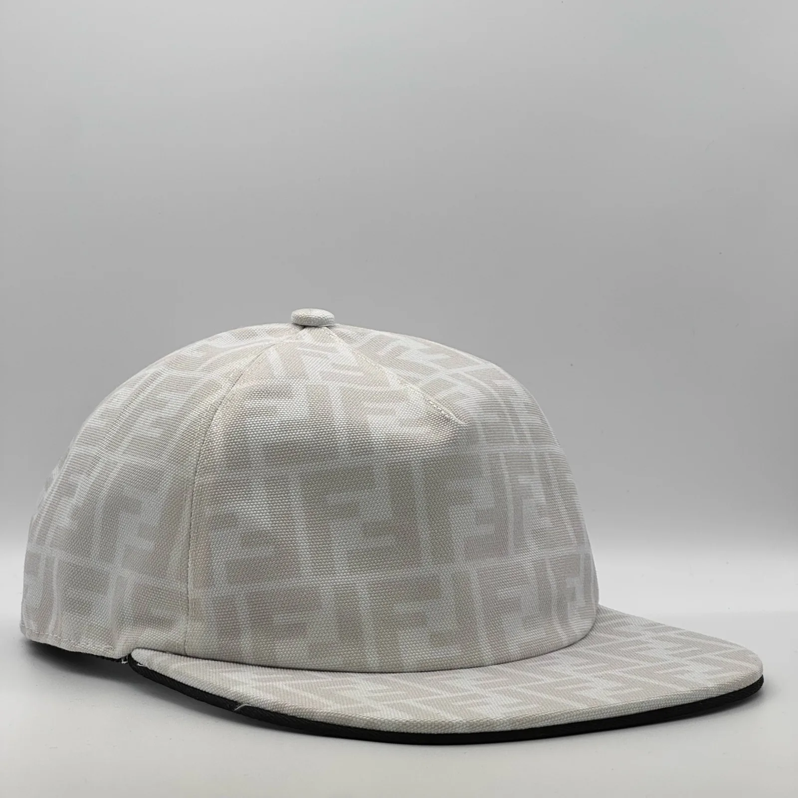 White Fendi FF cap, side profile with black edge piping.