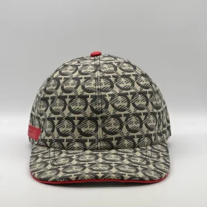 Ferragamo Gancini cap, front view in cream and charcoal weave with a red trim.
