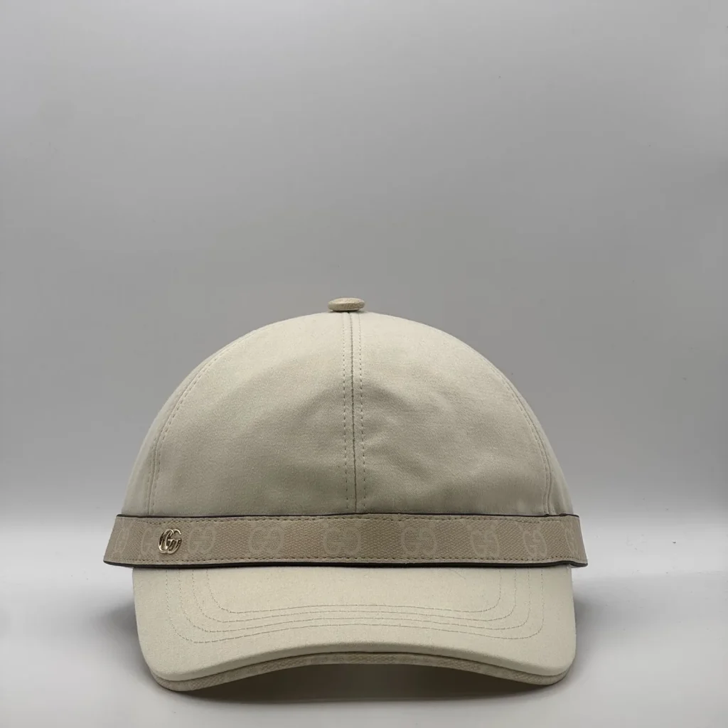 Cream cap with GG canvas brim trim and gold-tone logo, front view