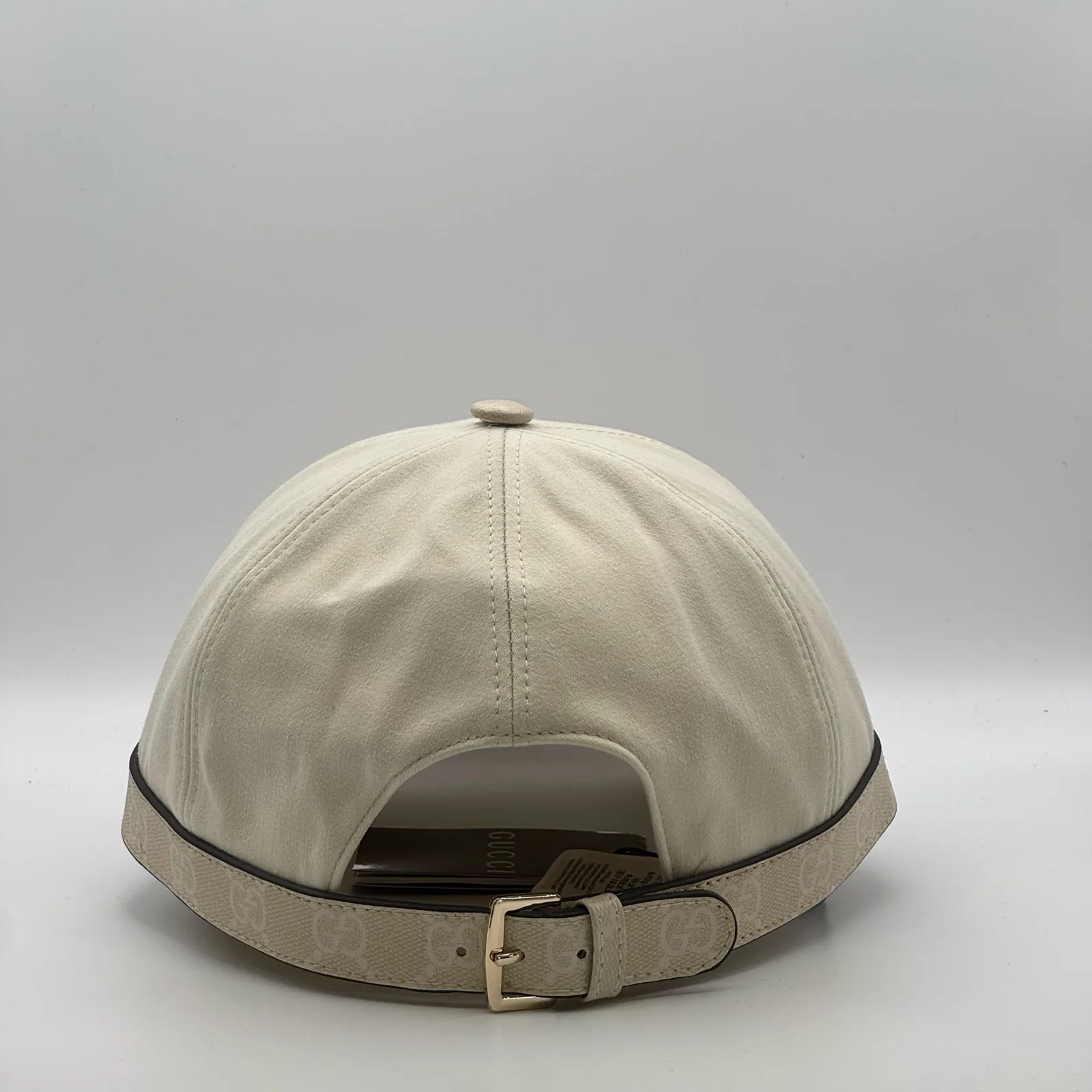 Cream GG band cap, back view with leather strap and buckle