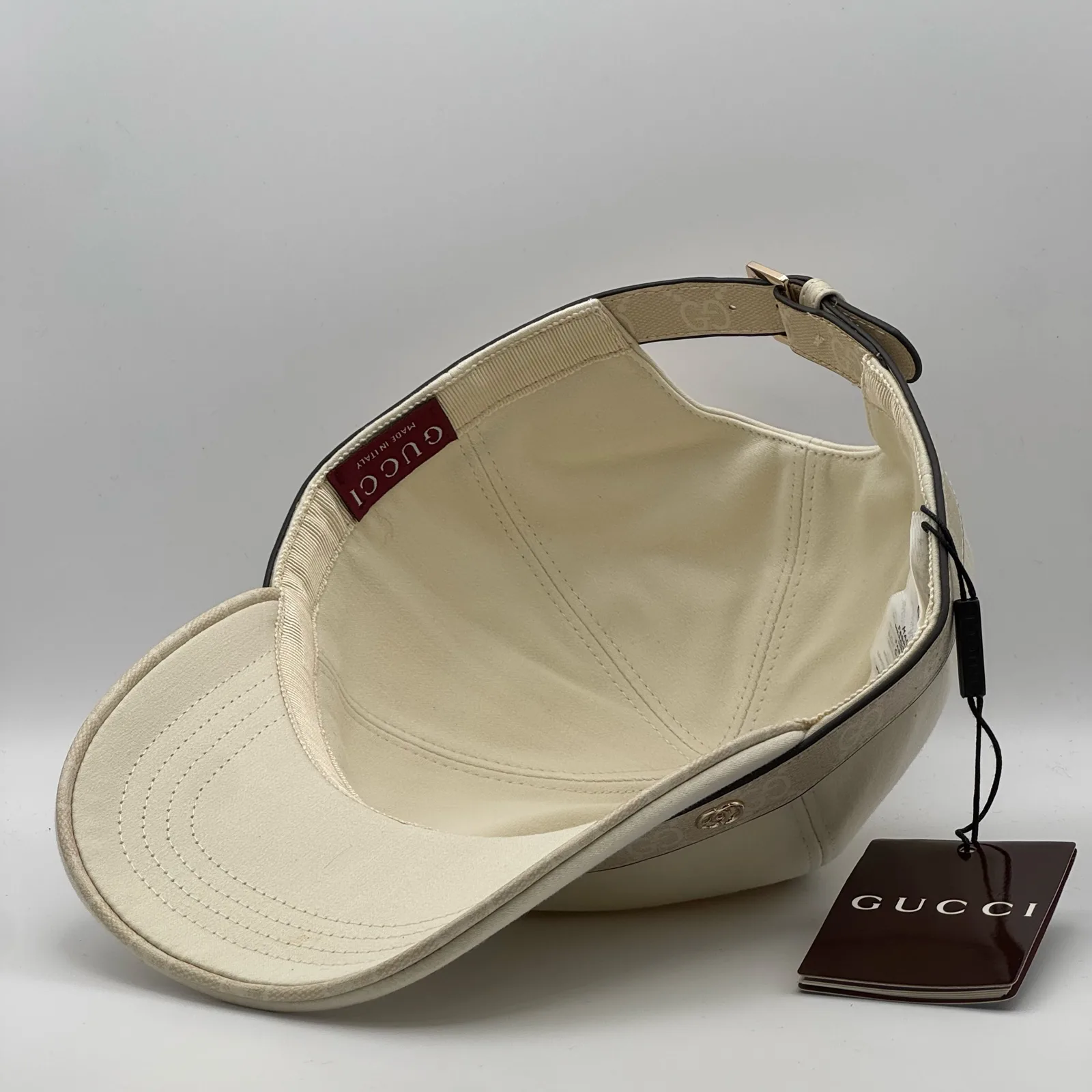 Cream GG band cap interior, hang tag on lining