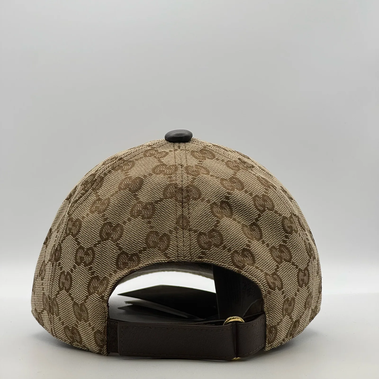 Beige GG canvas cap, back view with brown leather strap and gold-tone buckle