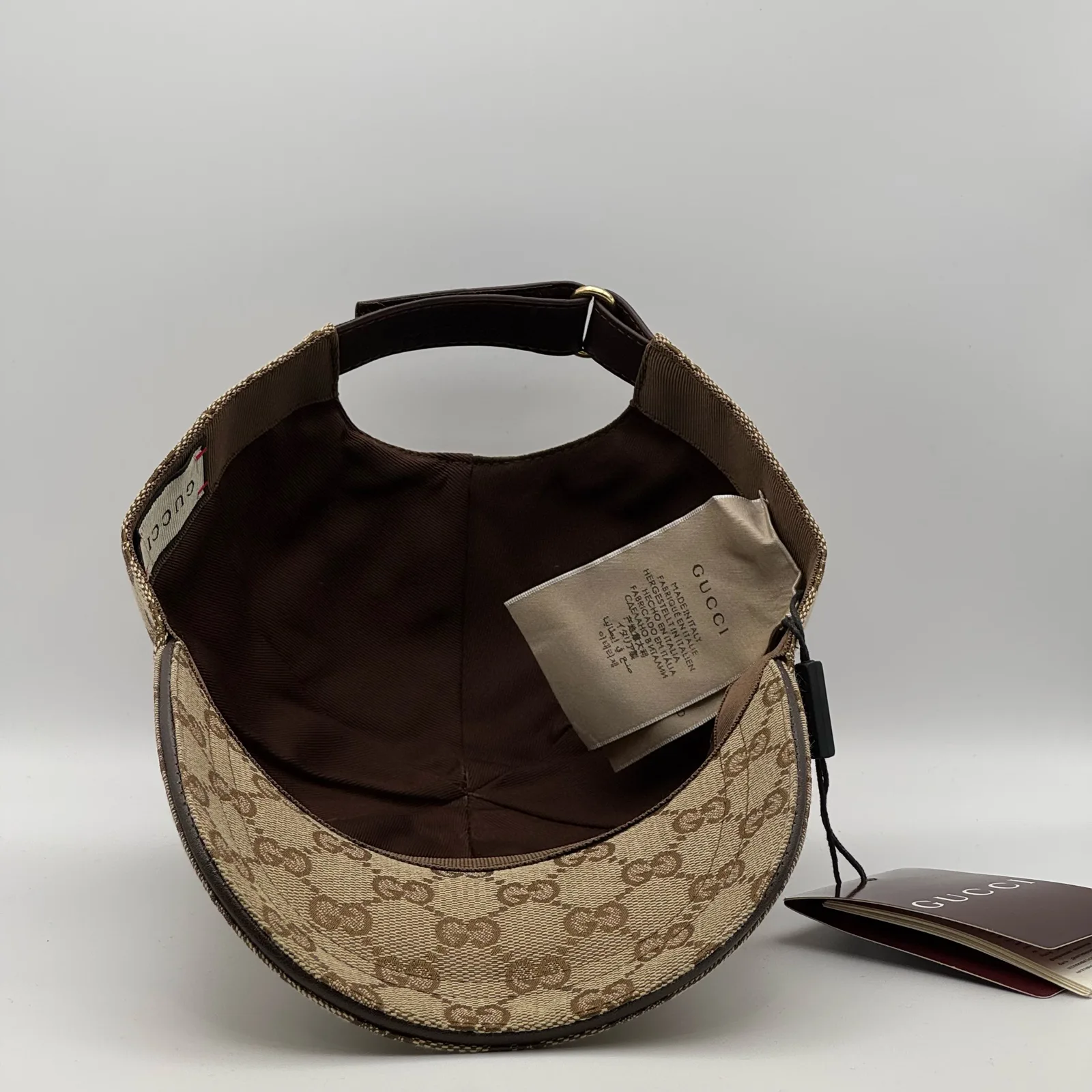 Beige GG canvas cap, underside view showing the brown interior lining