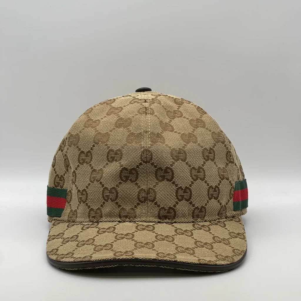 Beige GG canvas cap, front three-quarter view with green and red web stripe trim