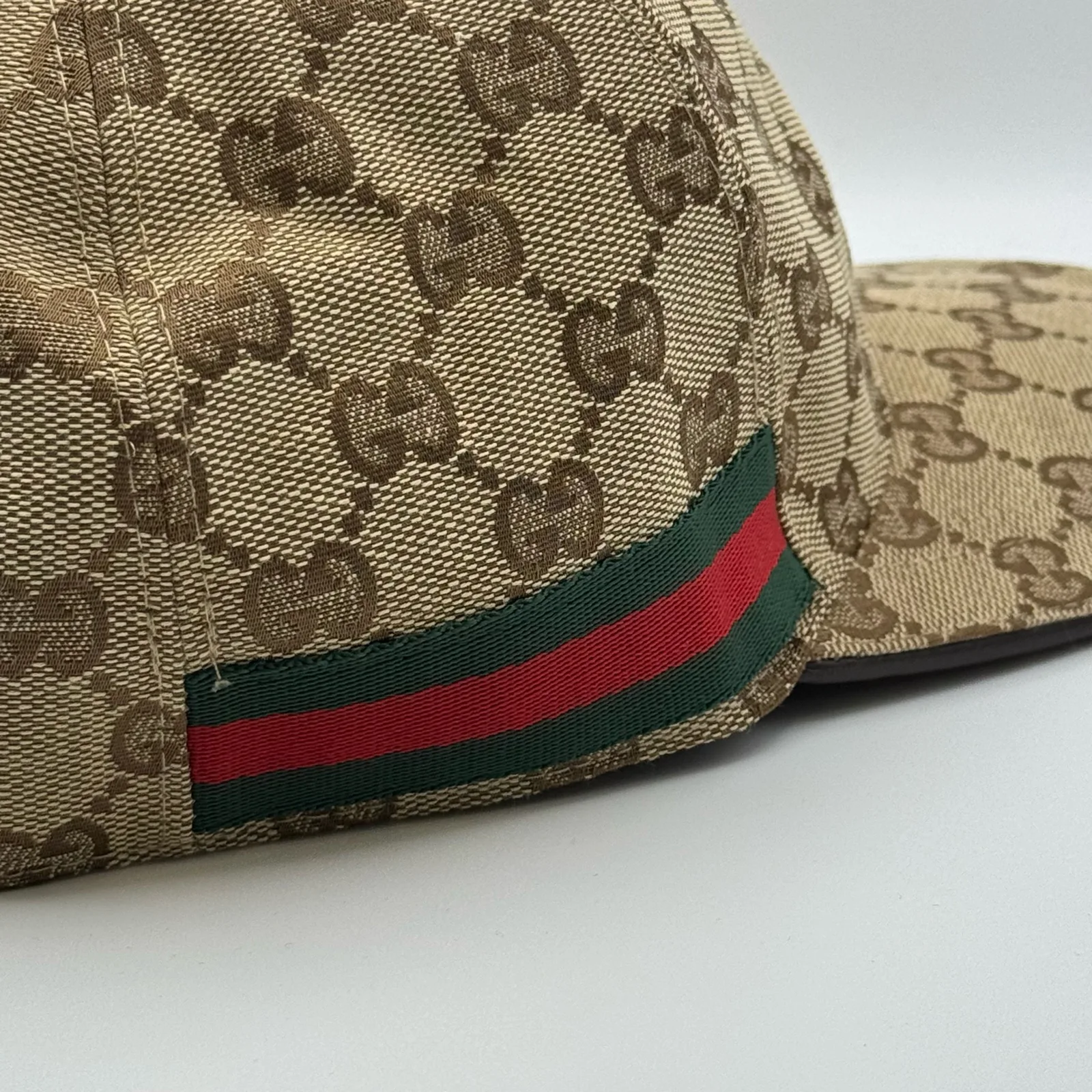 Beige GG canvas cap, close-up of the canvas weave and web stripe trim