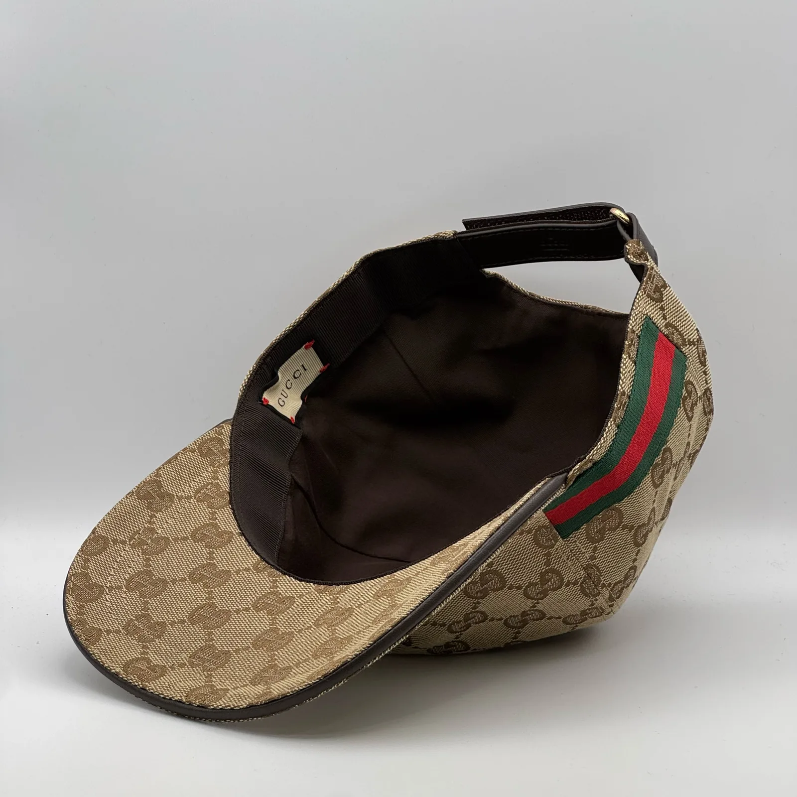 Beige GG canvas cap, interior view showing the lining and adjustable strap