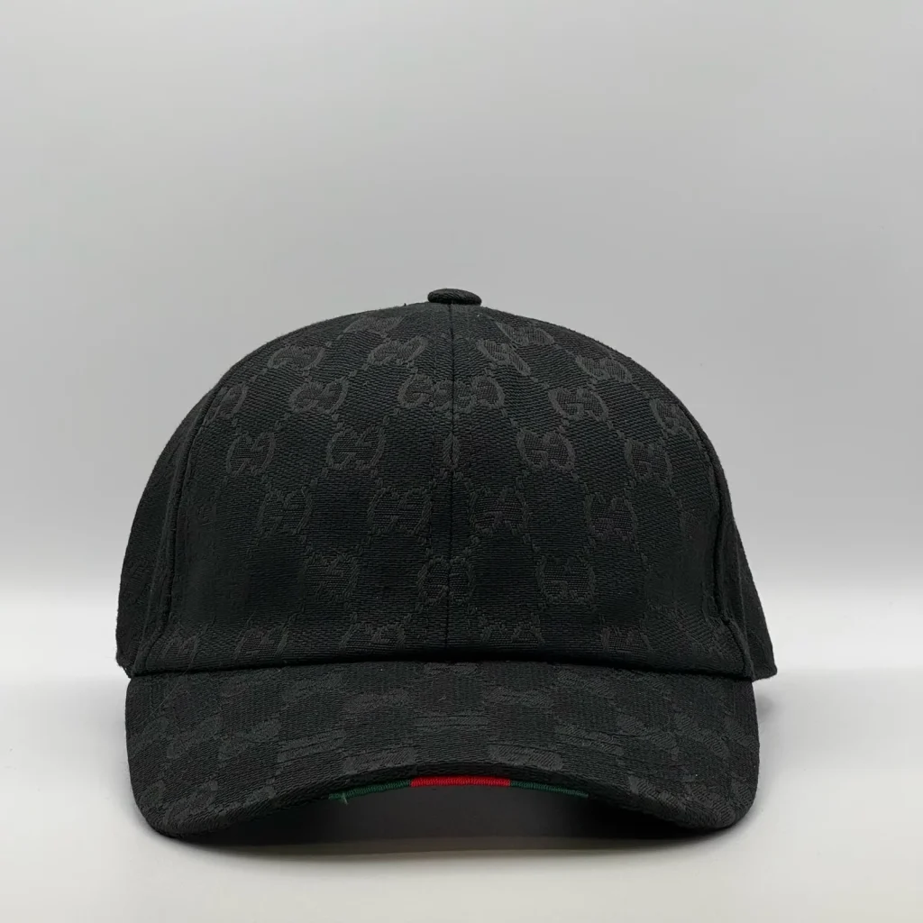 Black GG canvas cap, front three-quarter view with a subtle tonal jacquard pattern