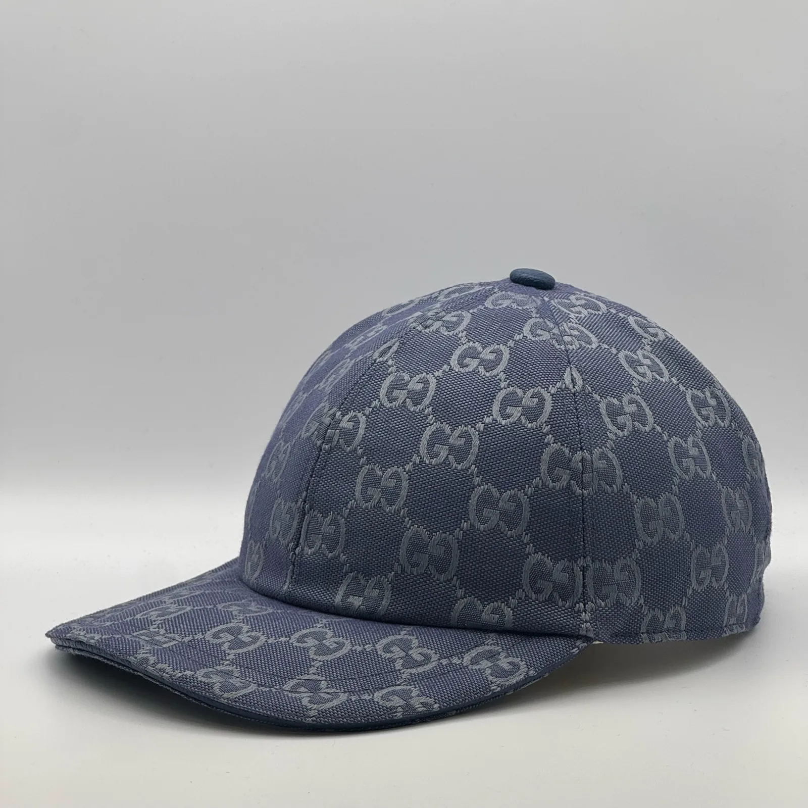 Denim blue GG canvas cap, front view showing the small gold logo detail