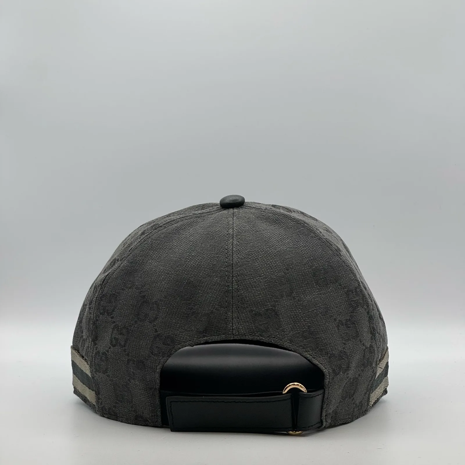 Charcoal grey GG canvas cap, back view with black leather strap and buckle