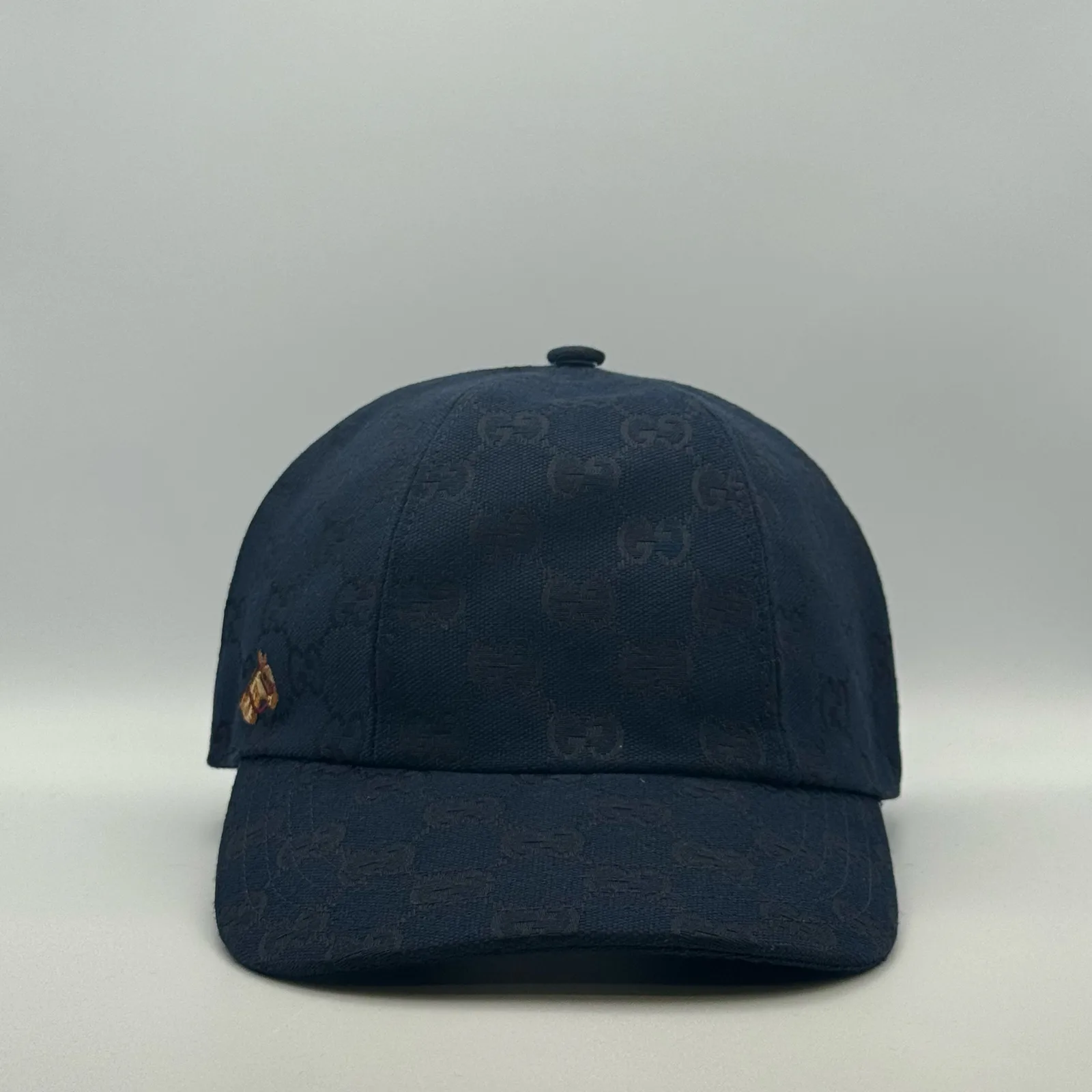 Navy GG canvas cap, front three-quarter view with a small embroidered horse patch