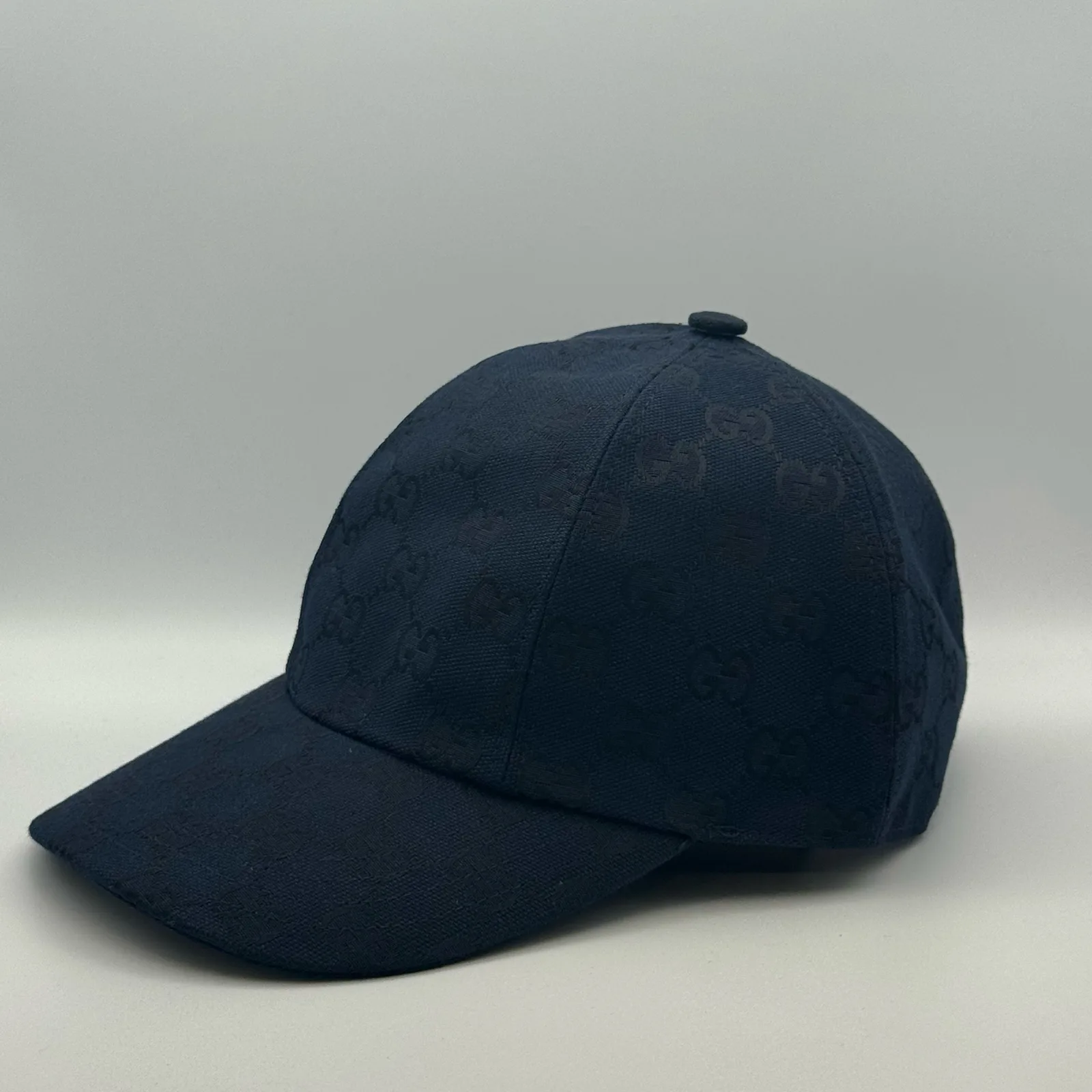 Navy GG canvas cap, front view showing the web stripe strap and buckle