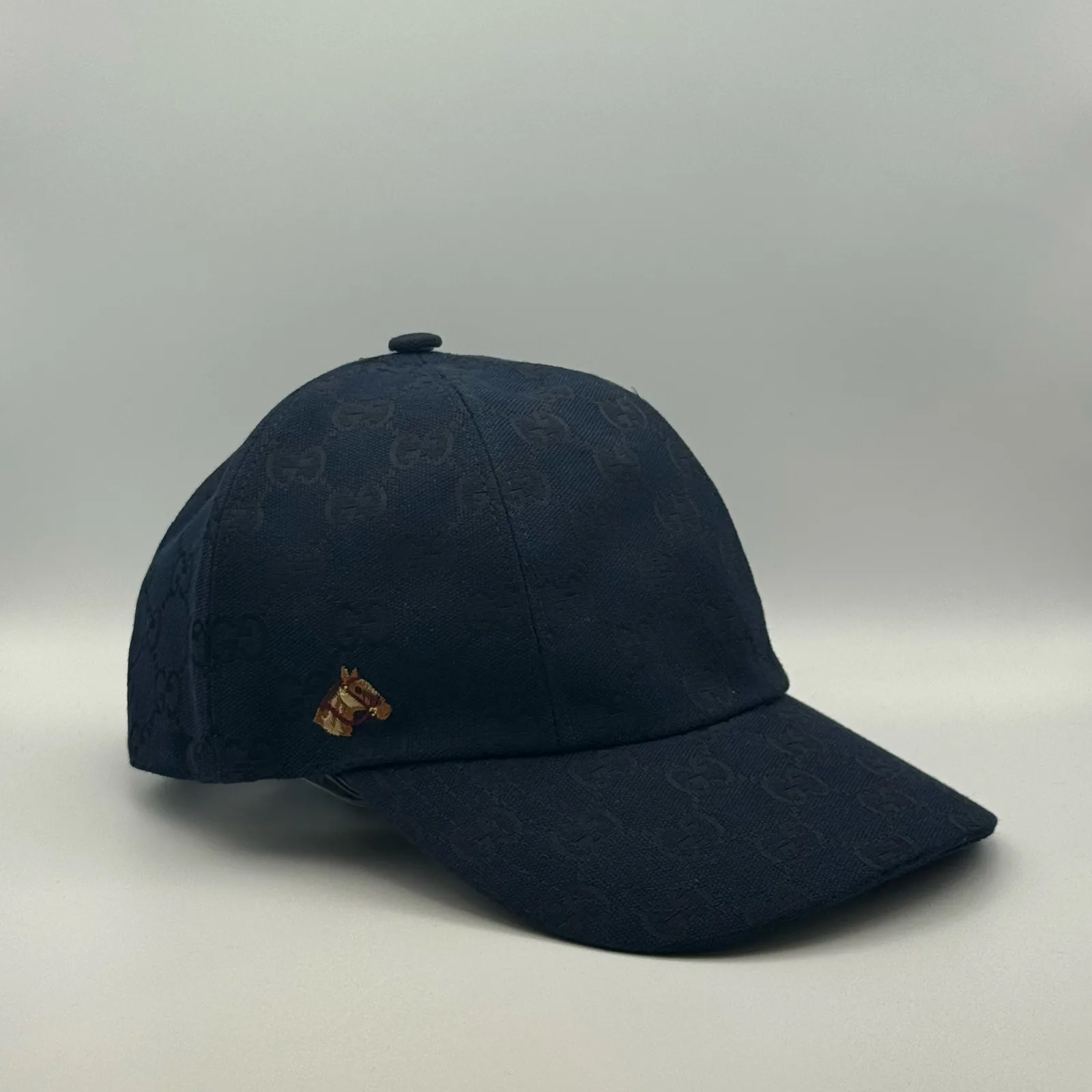 Navy GG canvas cap, side view showing the tonal jacquard pattern