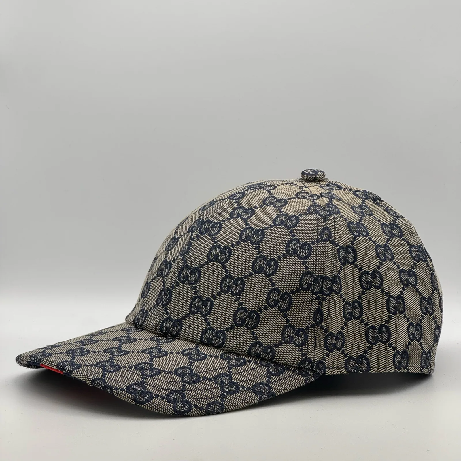 Navy and beige GG canvas cap, straight-on front view showing the GG jacquard pattern