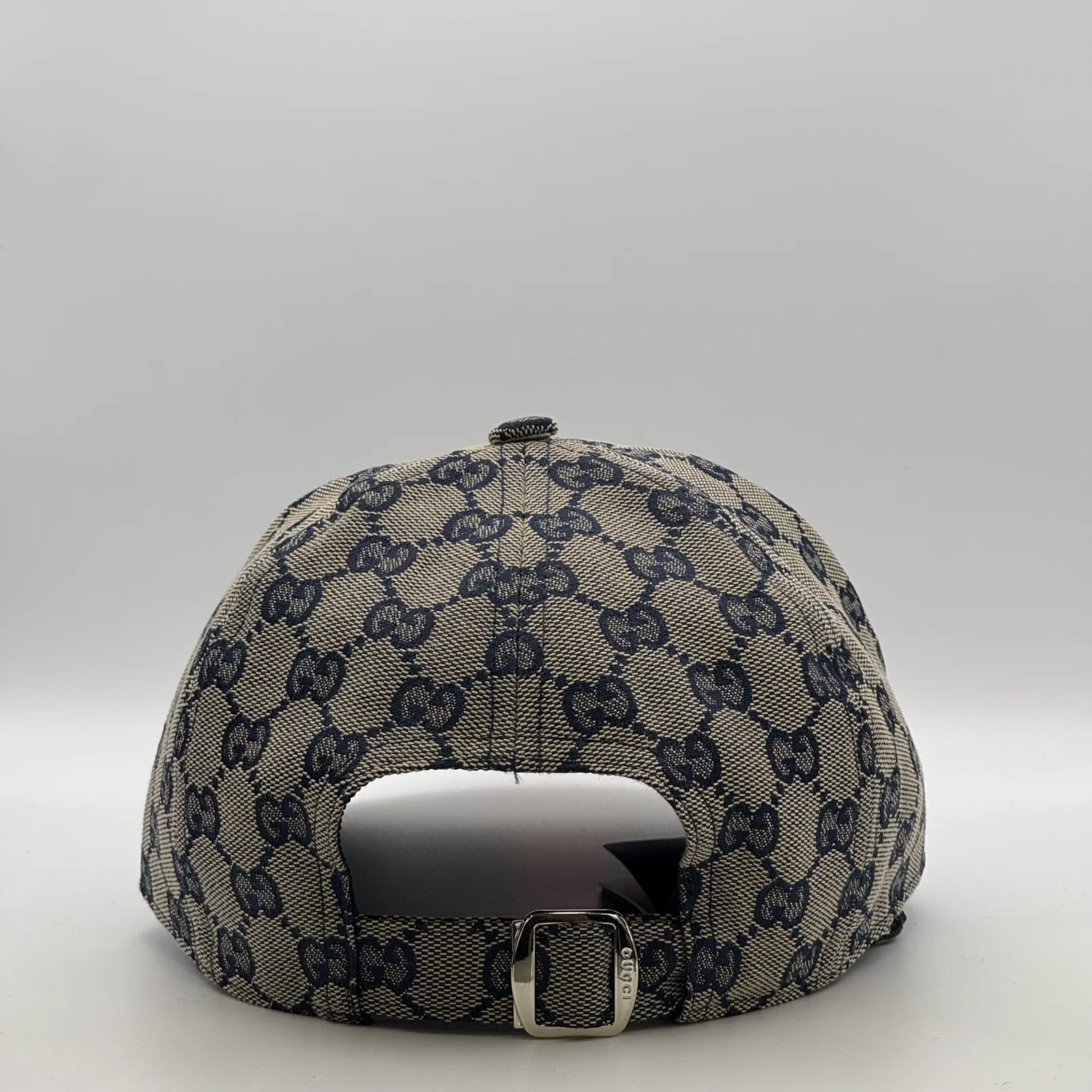 Navy and beige GG canvas cap, back view with leather strap and silver-tone buckle