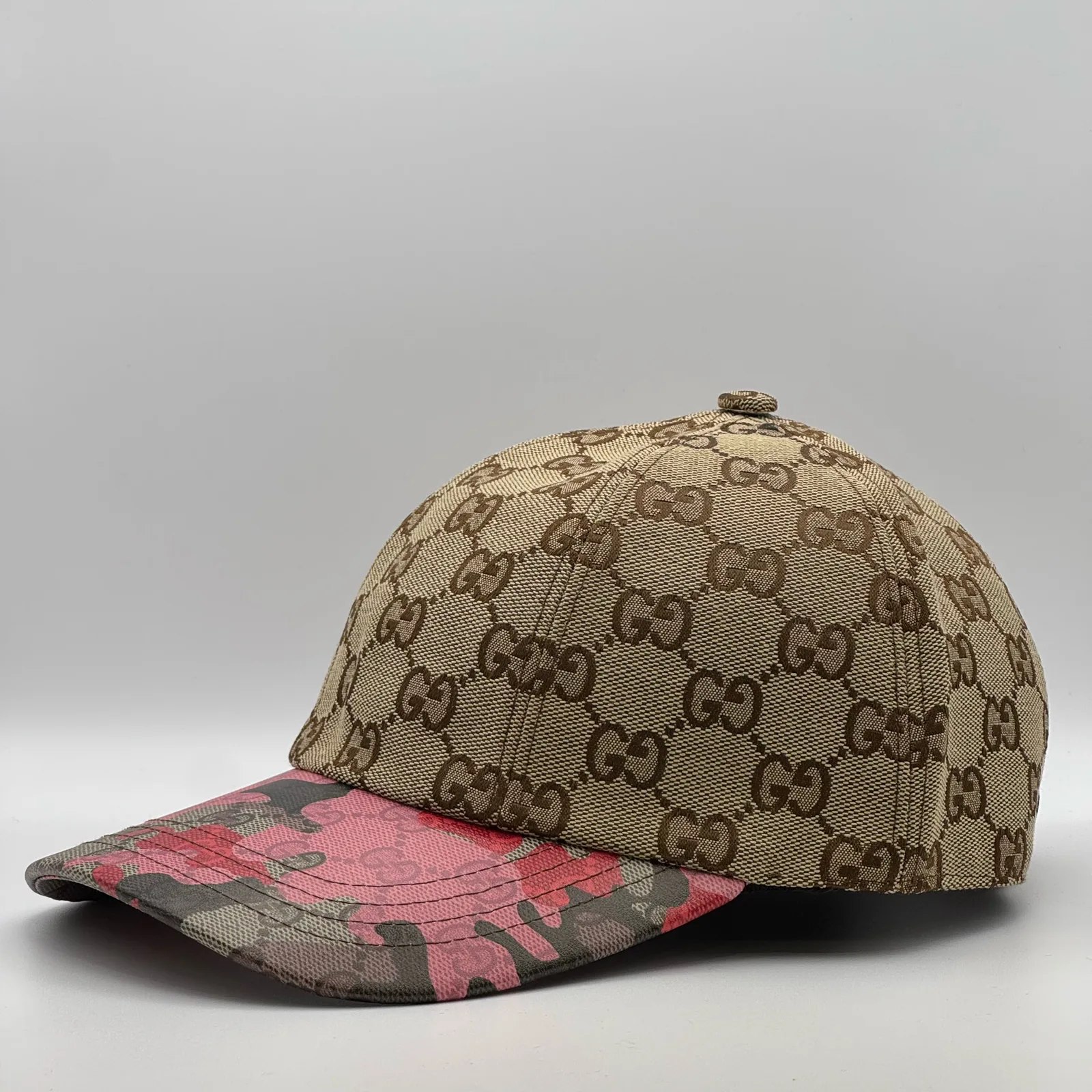 Beige GG canvas cap, front view showing the tan jacquard crown and floral brim