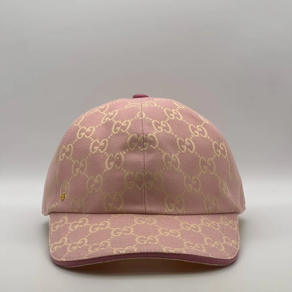 Pink GG canvas cap, front three-quarter view with a golden tan jacquard pattern