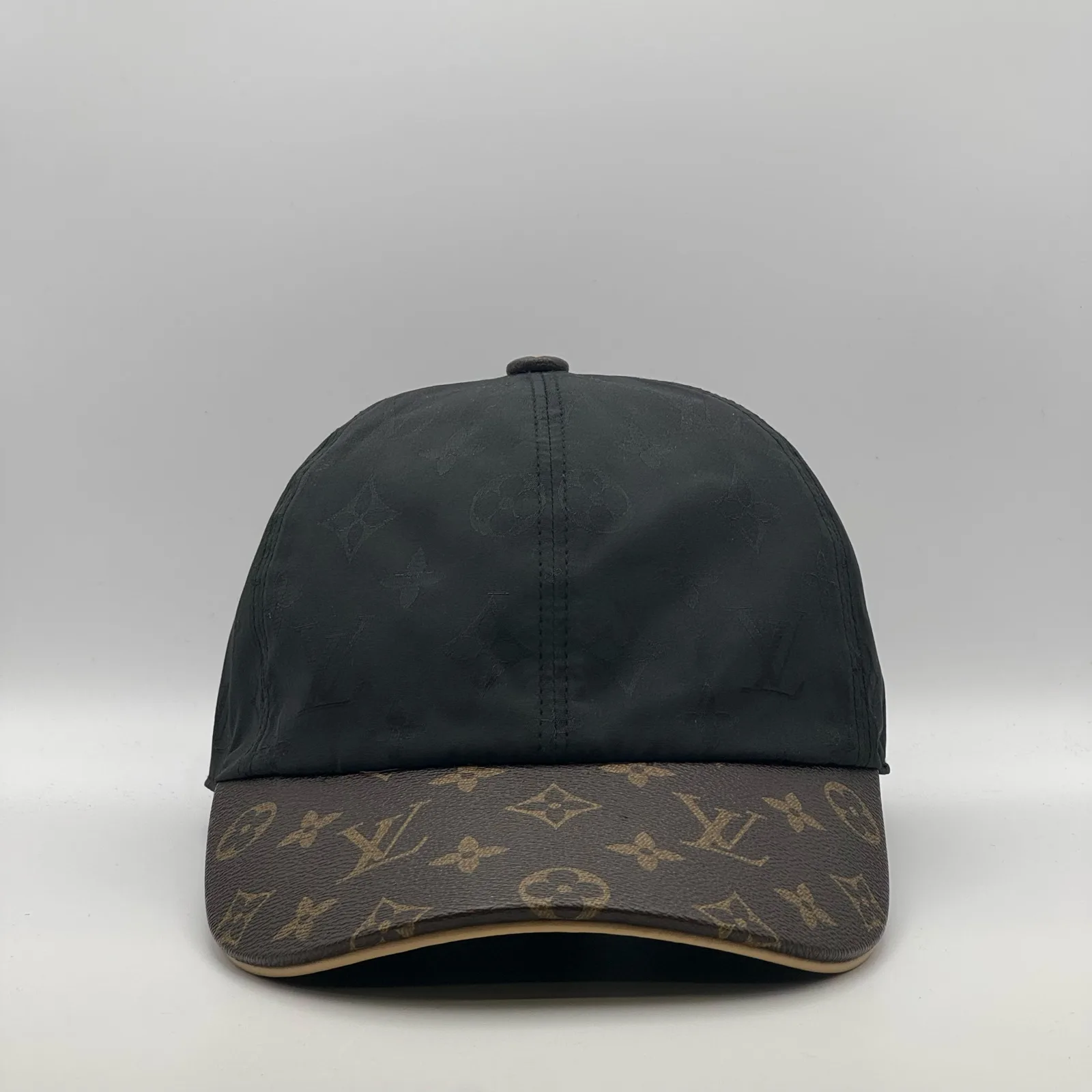 Black Louis Vuitton Monogram Brim cap, front view showing the monogram canvas brim.