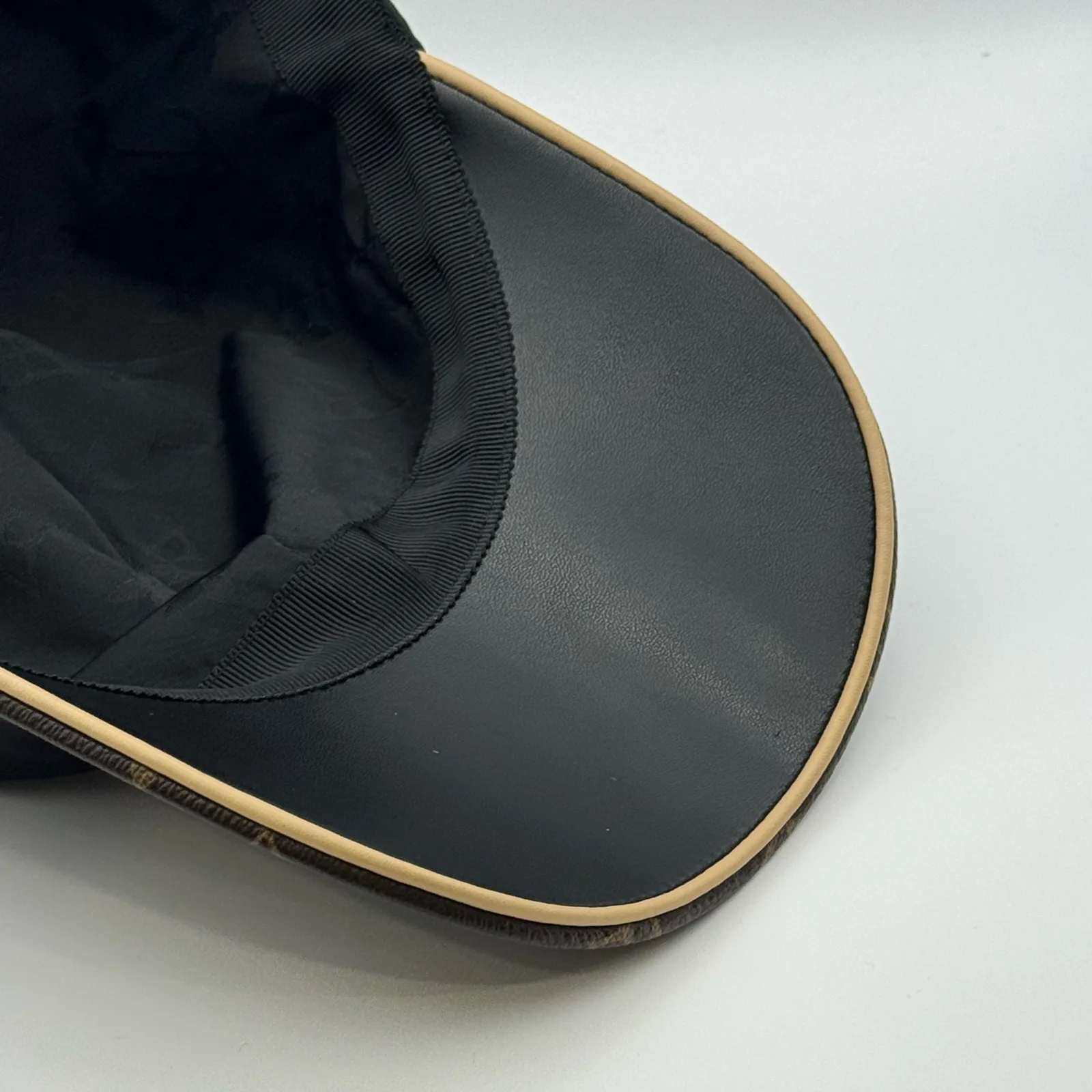 Close-up of the underbrim showing the monogram canvas lining.
