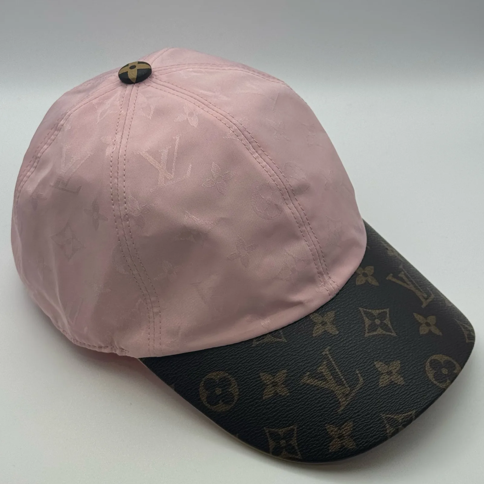 Pink monogram brim cap, front view.