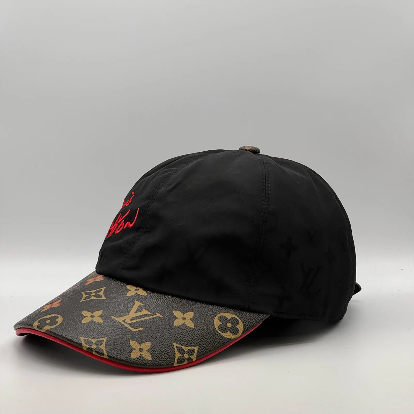 Black Signature cap, side profile view.